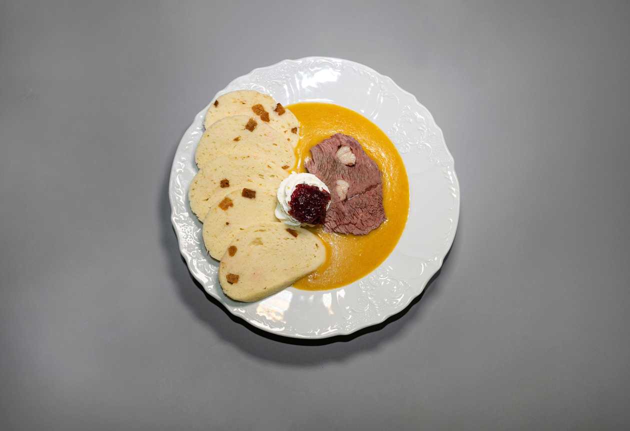 Beef tenderloin on sour cream, bread dumpling, cranberry sauce