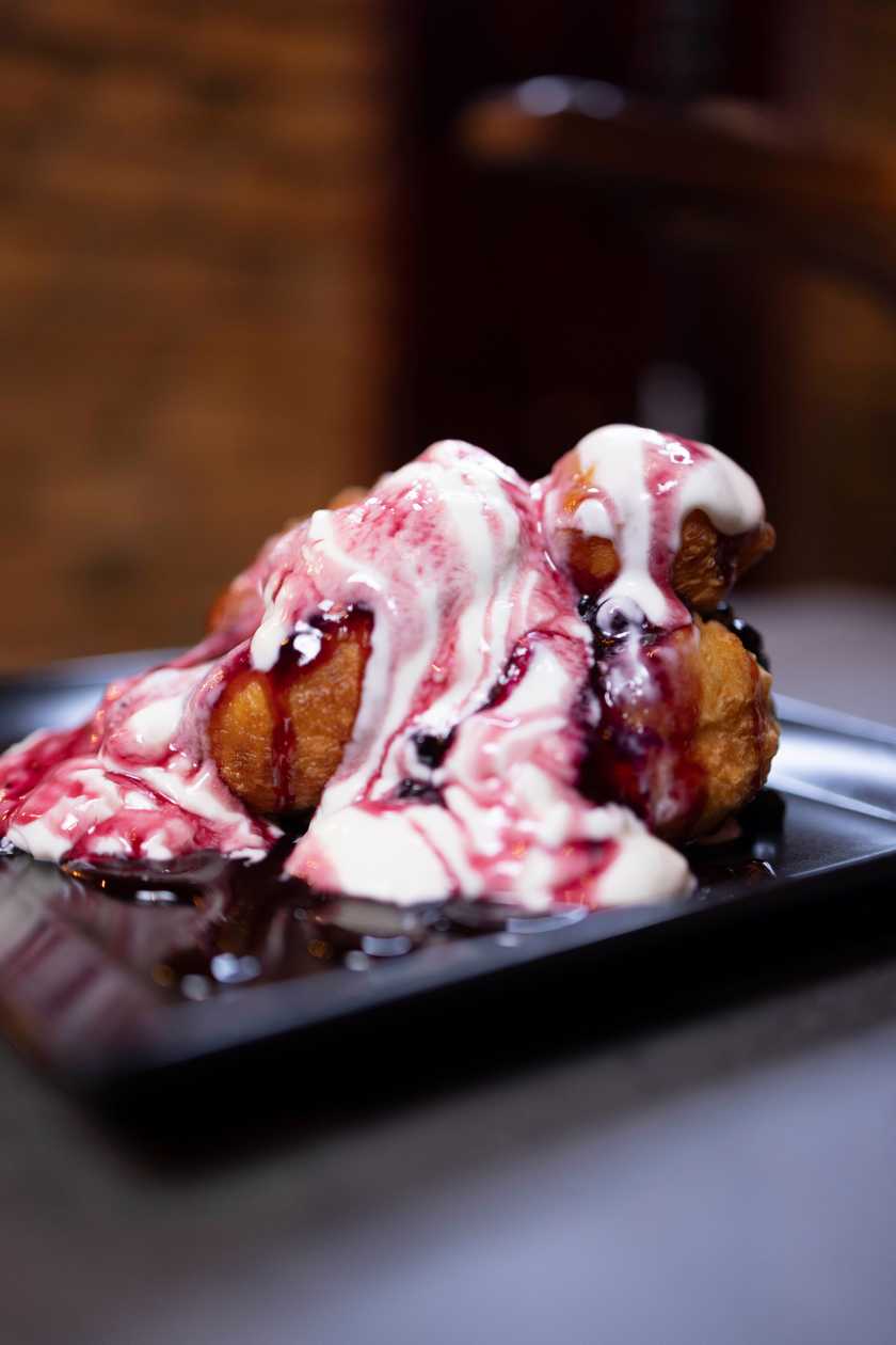Romanian cheese doughnuts with sour cream and jam