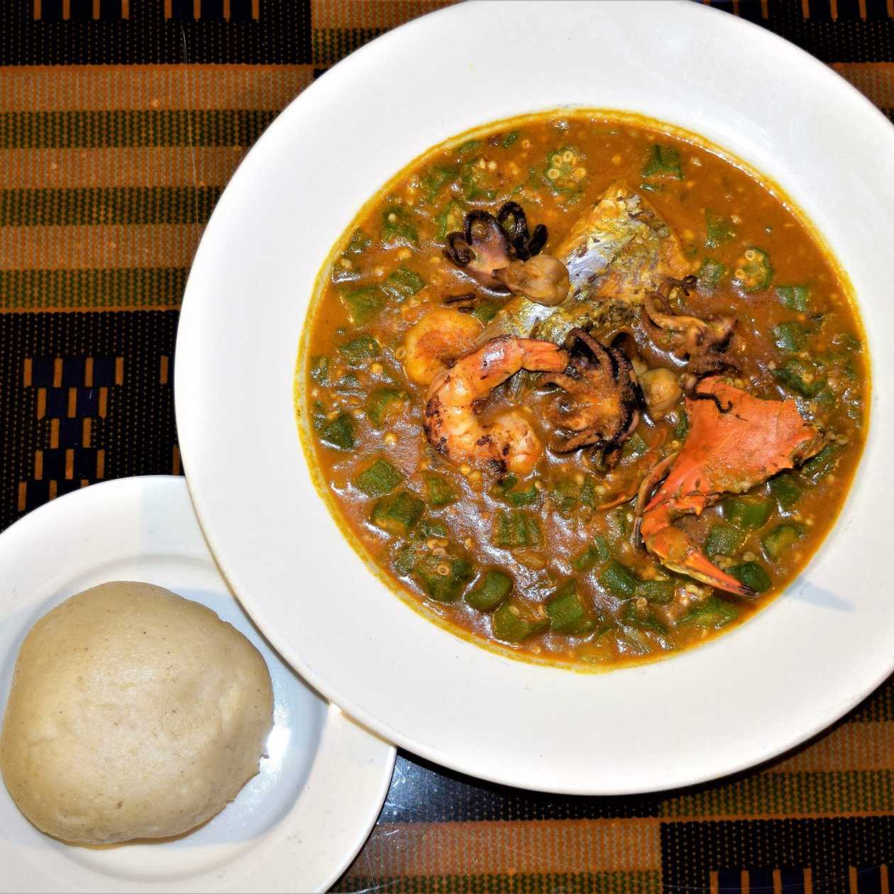 Banku With Chicken, Wele, Beef, Salmon, Groundnut and Okro Soup