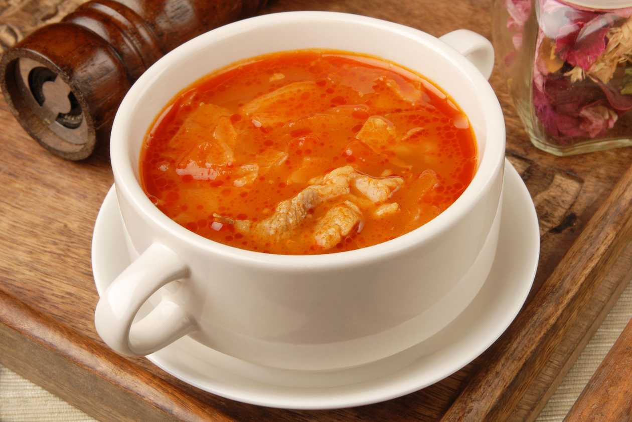 Fufu with Goat Meat, Chicken Wing and Light Soup