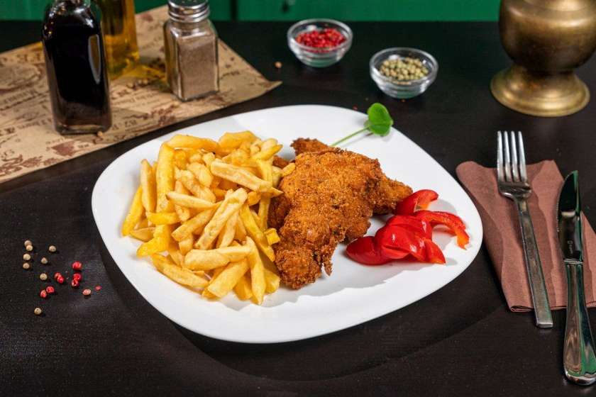Pork schnitzel and fries meal