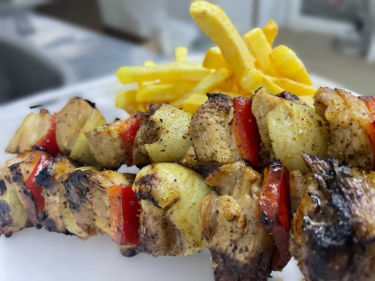 Grilled chicken skewers meal