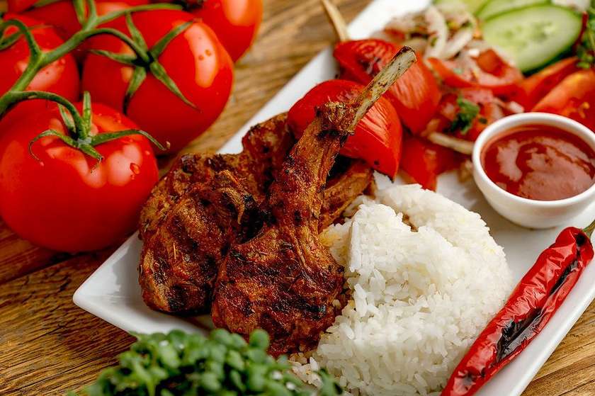 Grilled lamb chop with bone.