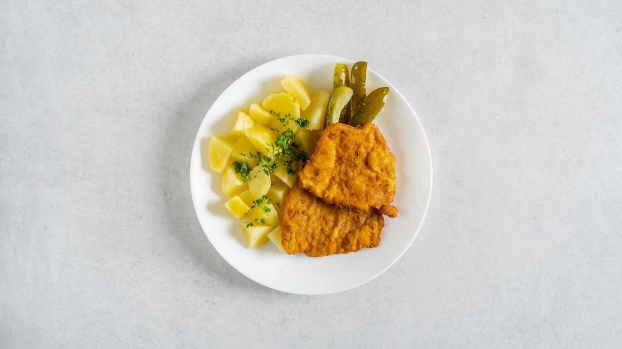 Fried pork schnitzel, cooked potato