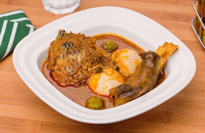 Banku  and palmnut / groundnut soup  .