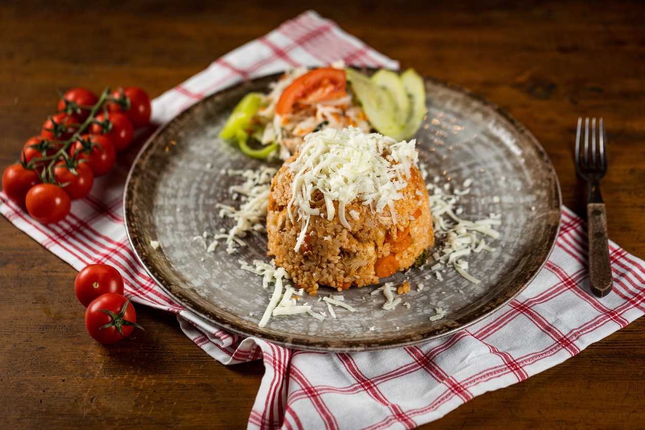 Chicken risotto with vegetables, vegetable garnish