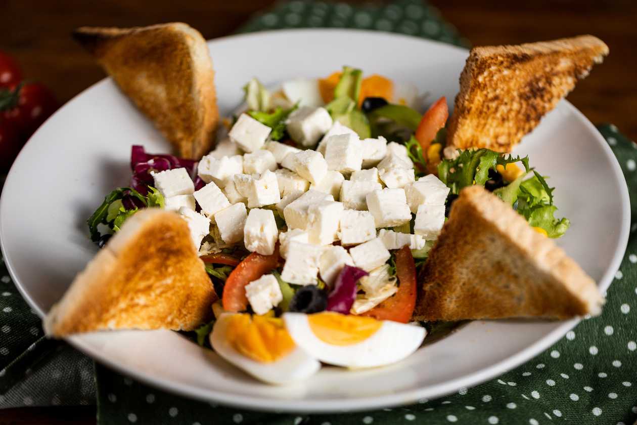 Vegetable salad with Balkan cheese, toast