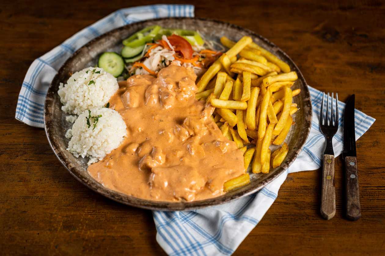 Chicken stroganoff, 1/2 rice, 1/2 fries, vegetable garnish