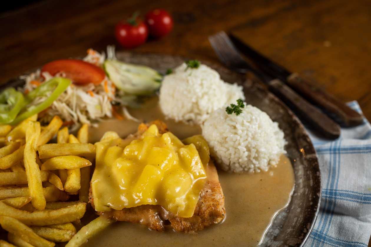 Natural chicken schnitzel Hawai, 1/2 rice, 1/2 fries, vegetable garnish