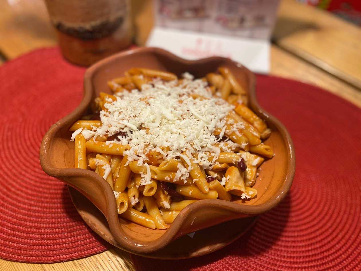 Pasta with chicken in red sauce with beans