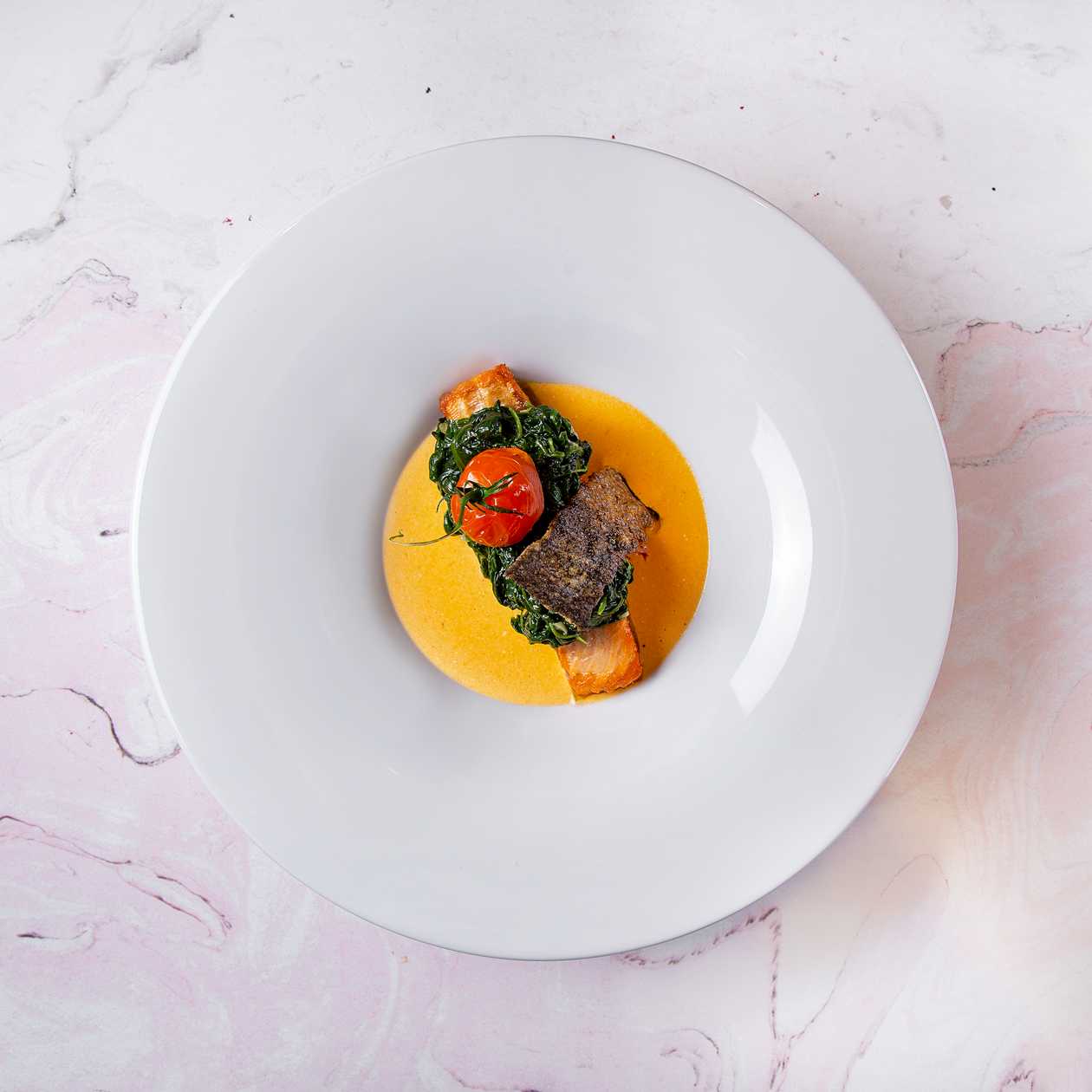 Salmon with spinach in Kamchatka crab sauce