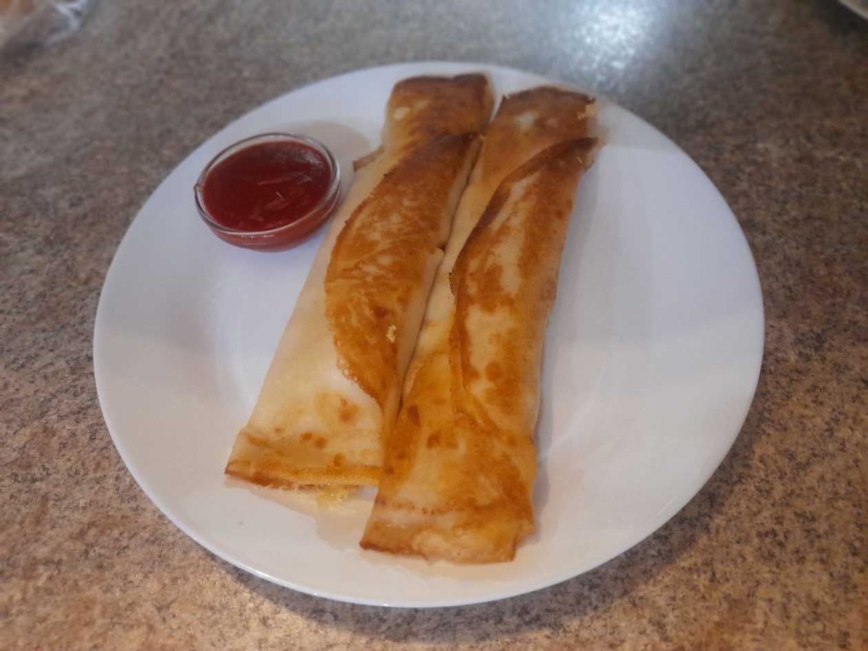Crepes with sausages and cheese