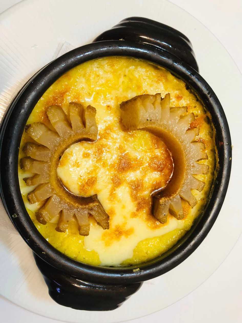 Polenta folded with cheese, sour cream and smoked bacon