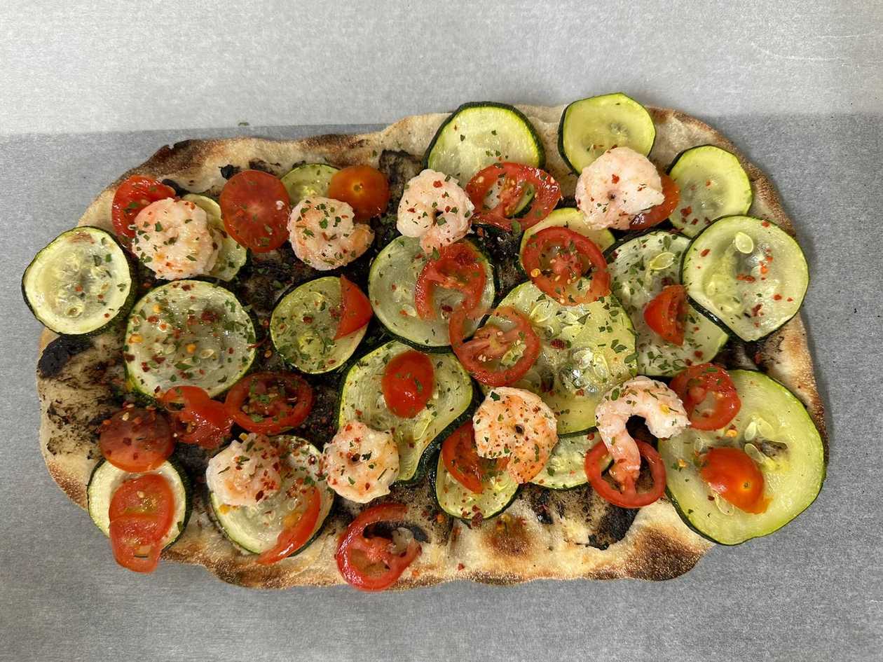 Prawns, truffle cream and zucchini pinsa
