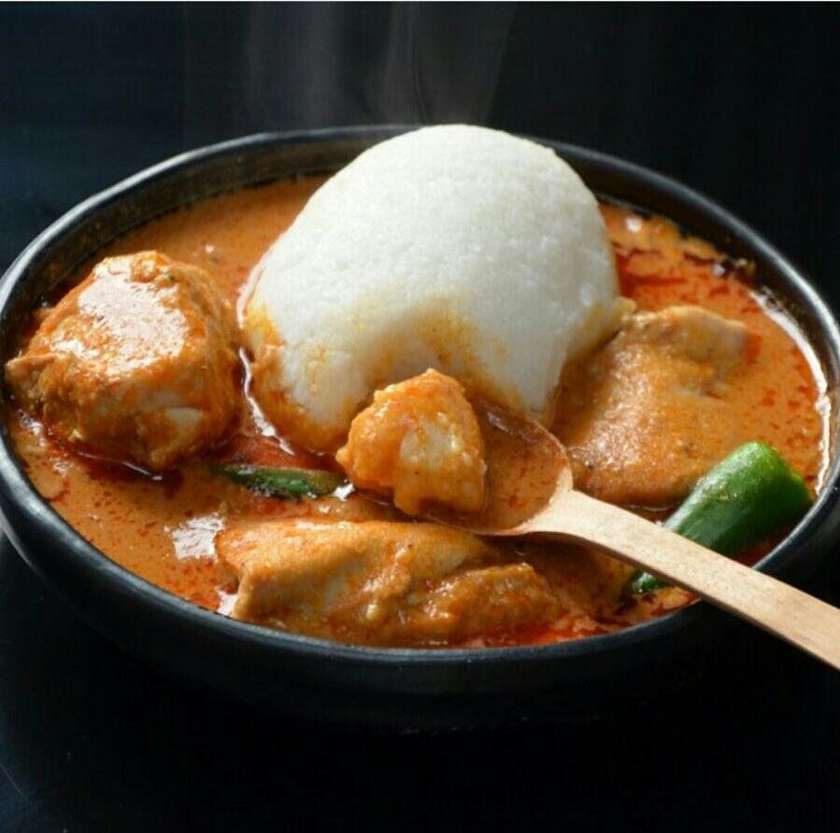 Three Balls of Rice with Palmnut Soup and Mixed Meat