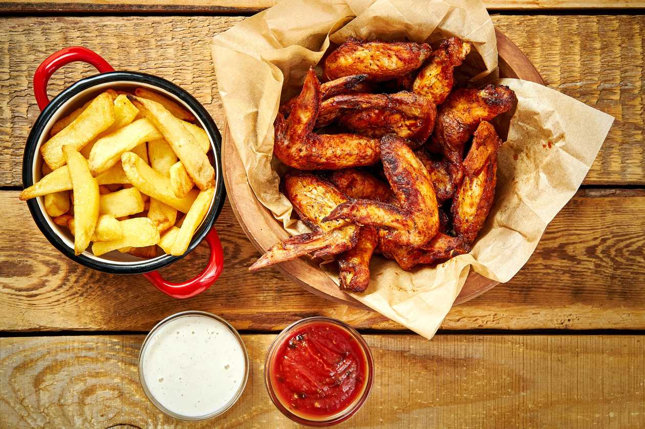 Fried chicken pieces with fries