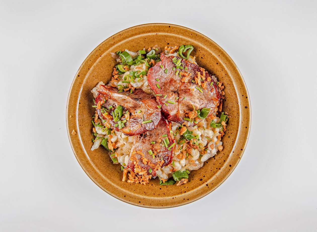 Potato dumplings with sauerkraut and bacon, chives, fried onions