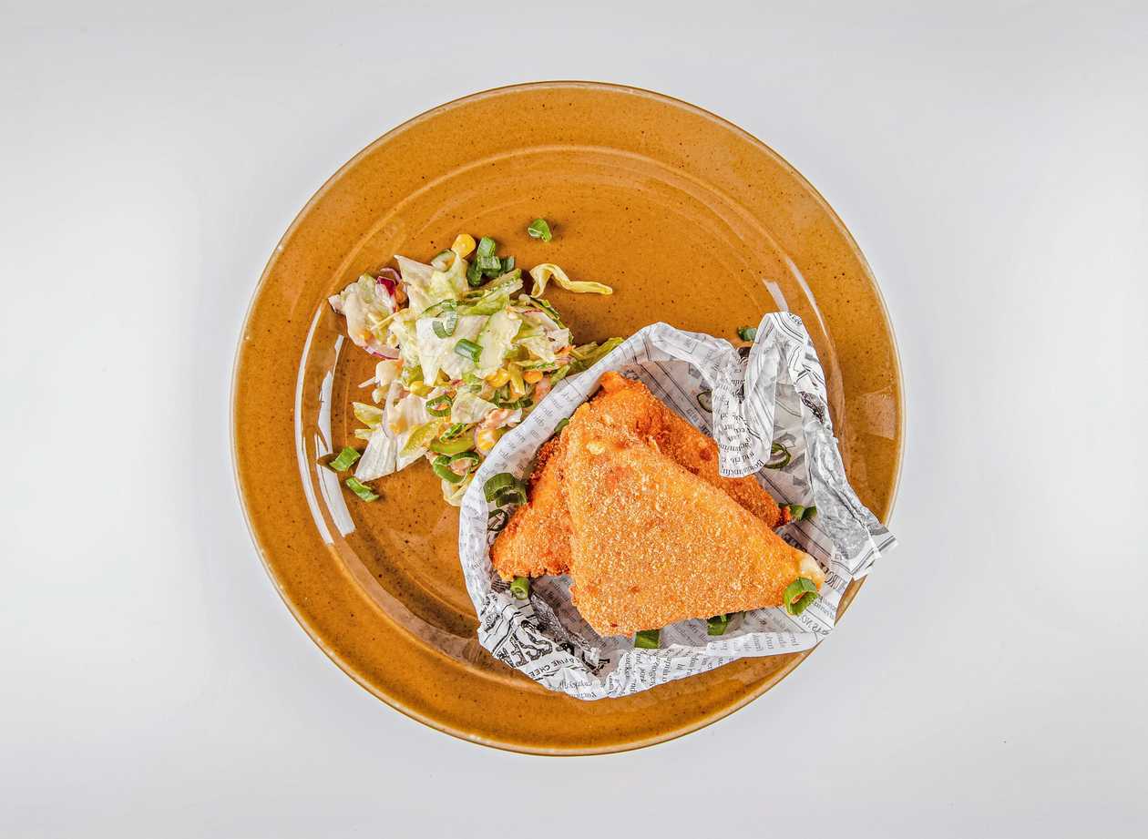 Fried cheese with ham, seasonal vegetable salad