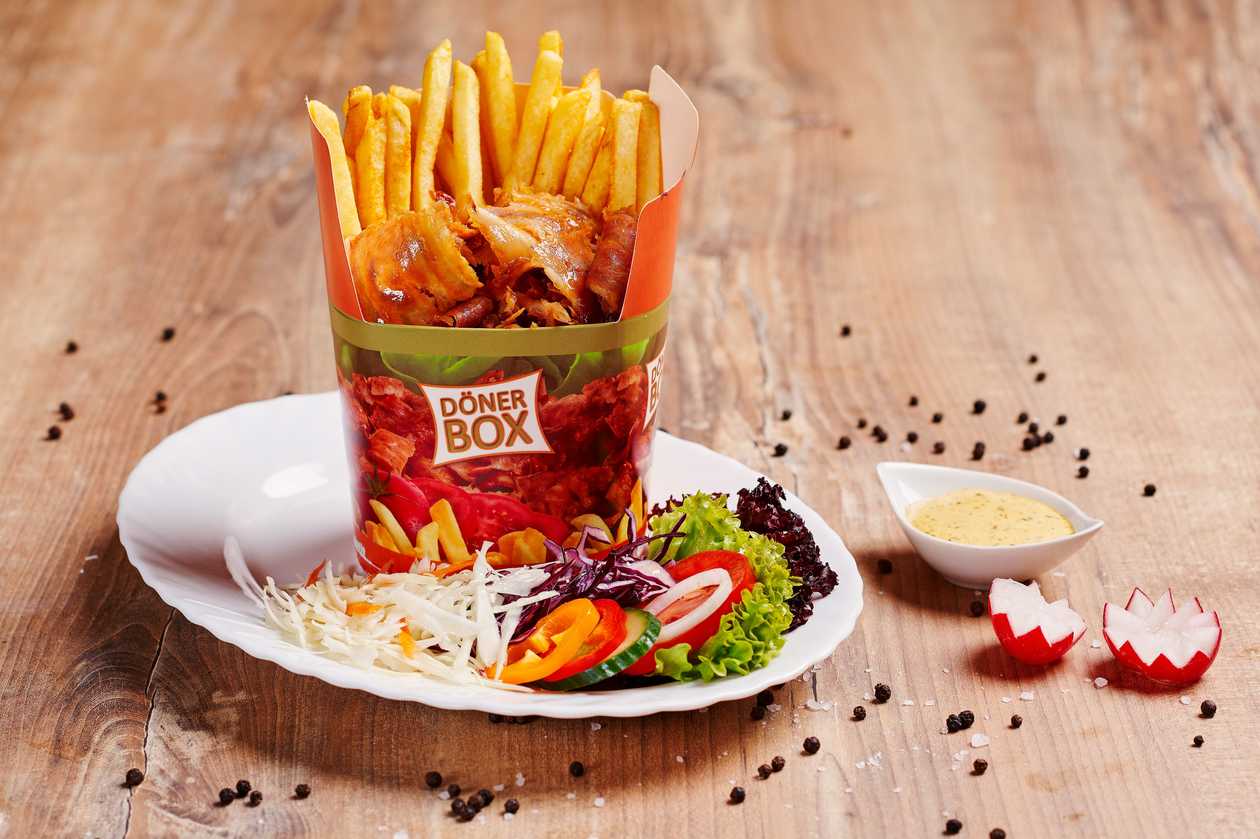 Kebap box in a cone with salad
