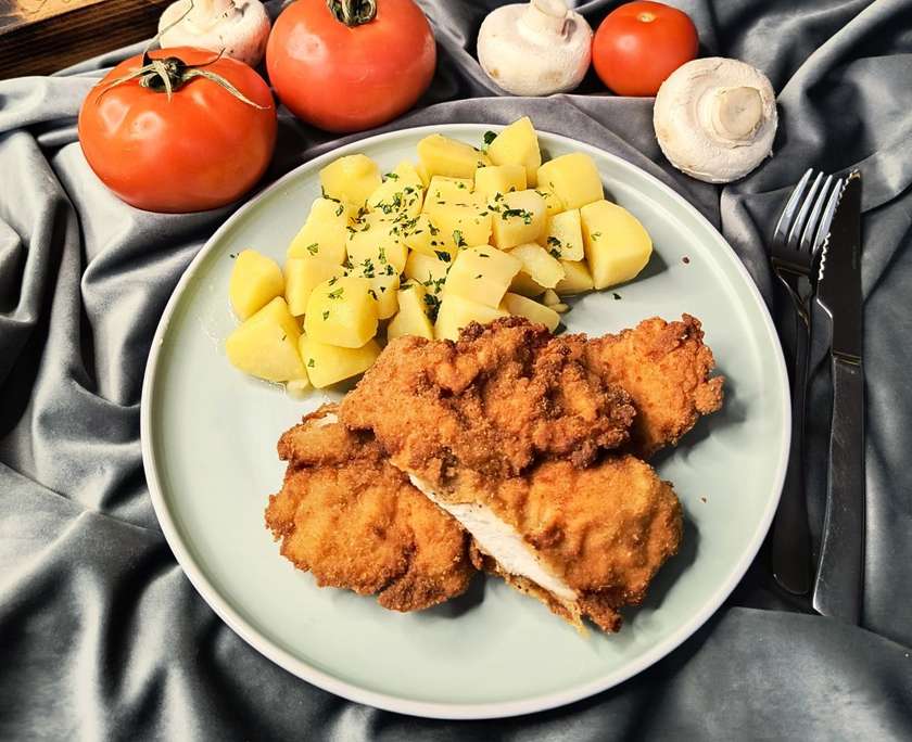 Fried chicken schnitzel, buttered potatoes