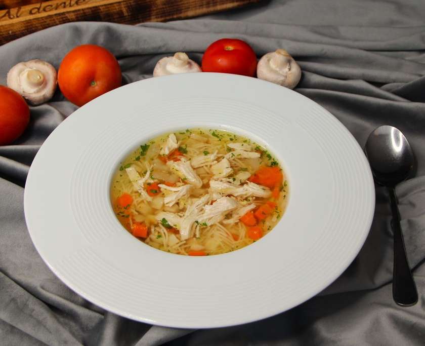 Chicken broth with meat, noodles and vegetables