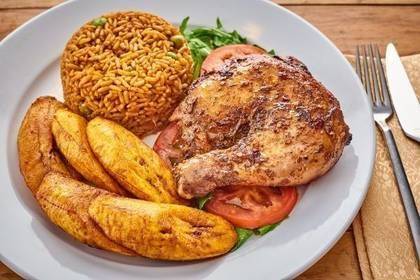Jollof Rice Served with Chicken & Plantains