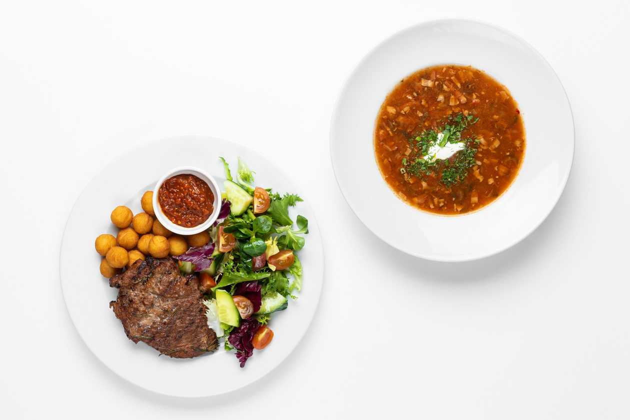 Spicy hearty soup and a pork loin with 2 sides of your choice