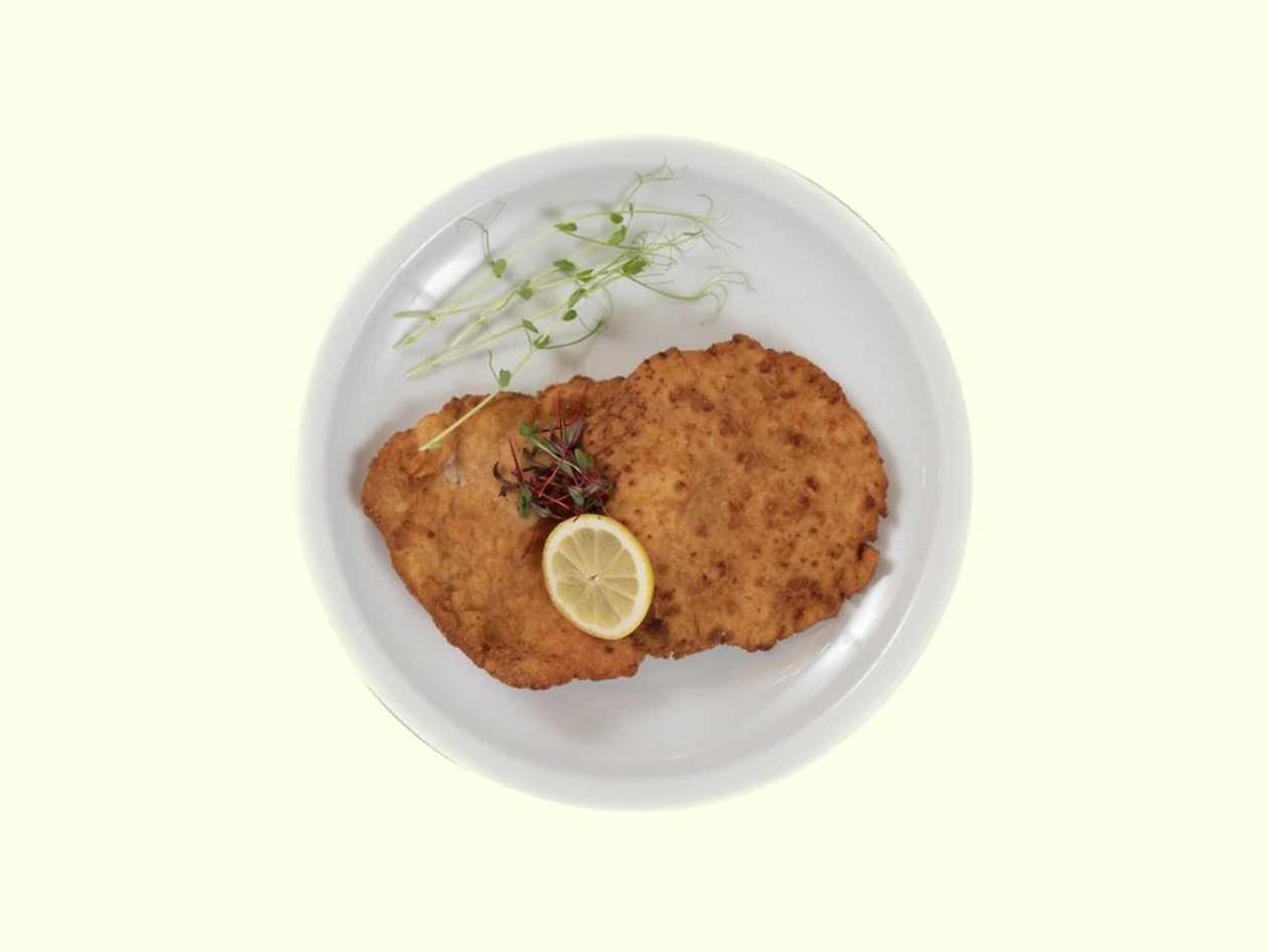 Fried pork schnitzel, garnish, lemon