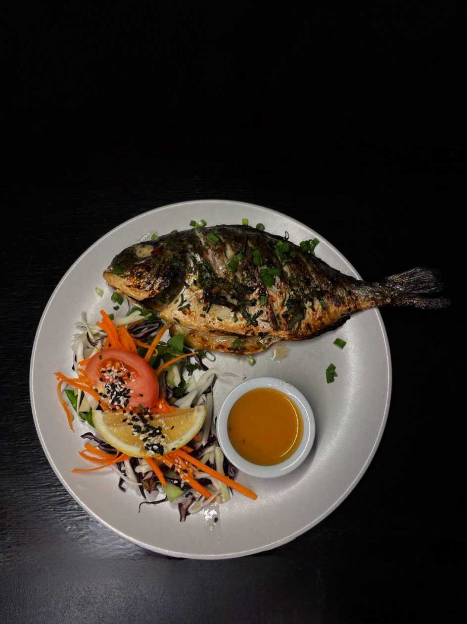 Dorado marinated in Mediterranean spices with seasonal vegetable fries and caper sauce