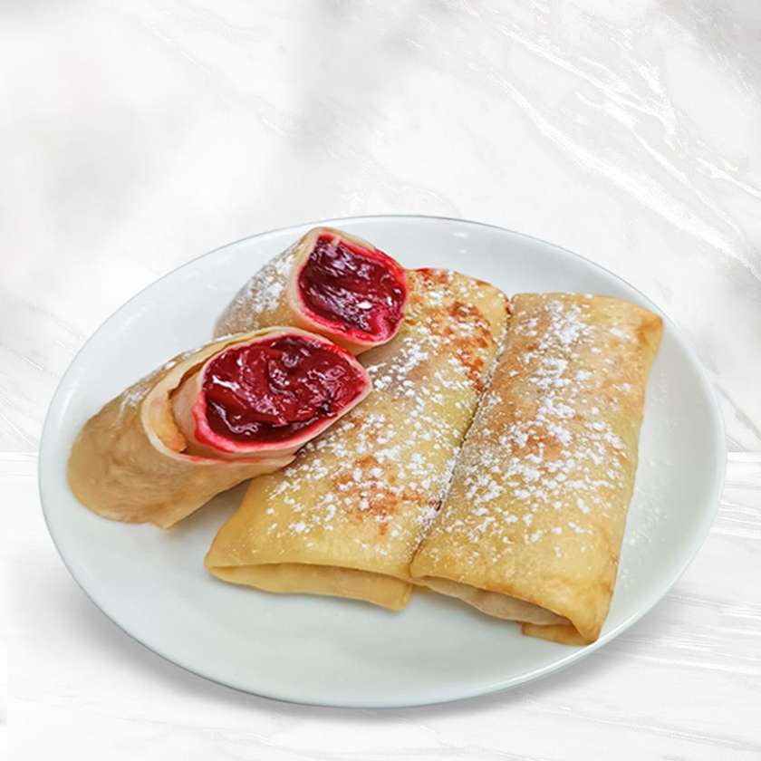 Млинці з вишневою начинкою