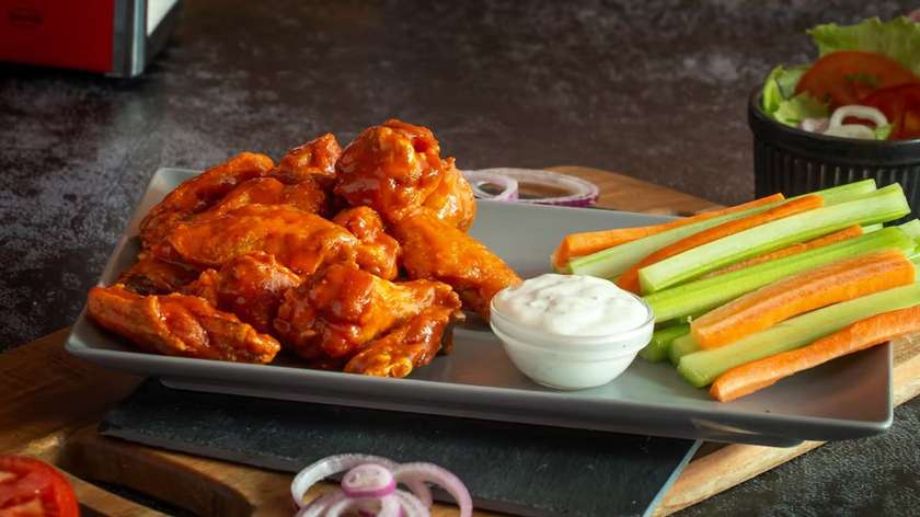 Buffalo hot wings + vegetables