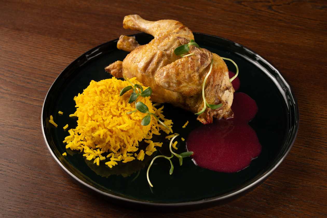 Corn fed chicken with rice and cranberry-rosemary sauce