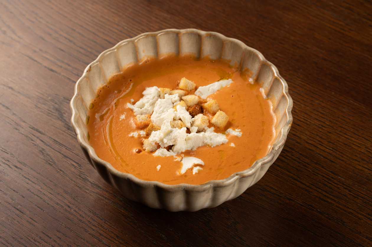 Sweet potato-paprika cream soup with goat cheese