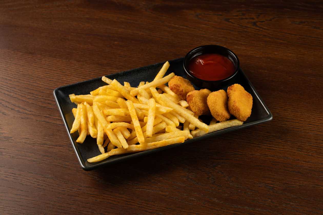 Chicken nuggets with french fries and ketchup