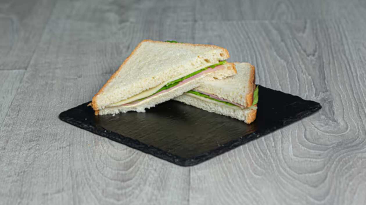 Sandwich with turkey, cheese, tomato, lettuce