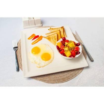 Eggs and Toast with a Fruit Bowl