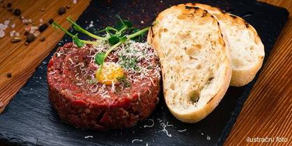 Tartar beef tenderloin steak with bread toasts