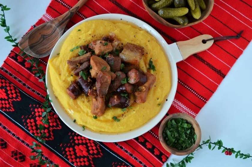 Pig's feast with polenta, garlic, and cabbage juice
