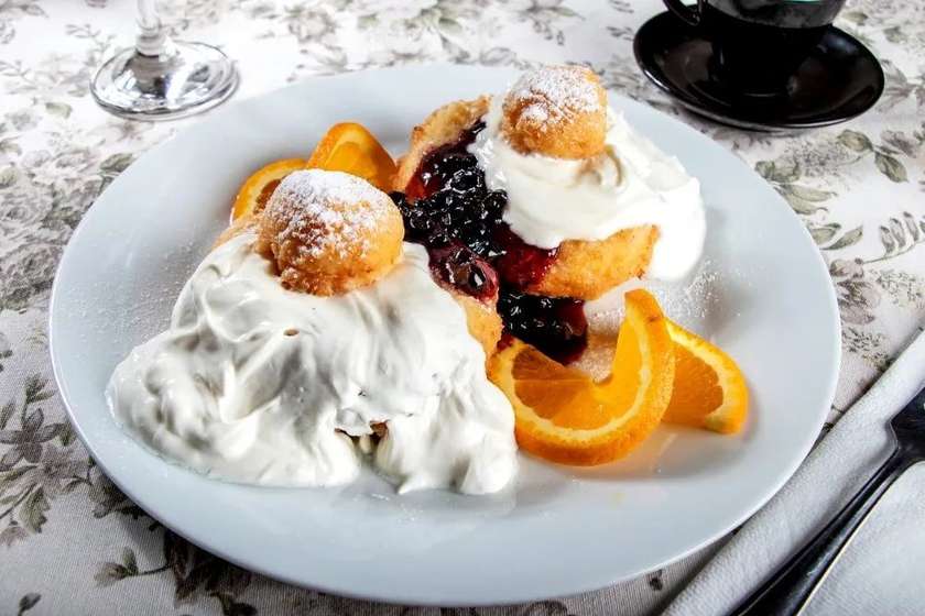 Romanian cheese doughnuts with homemade jam and sour cream