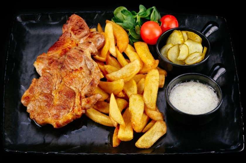 Grilled pork neck with fries