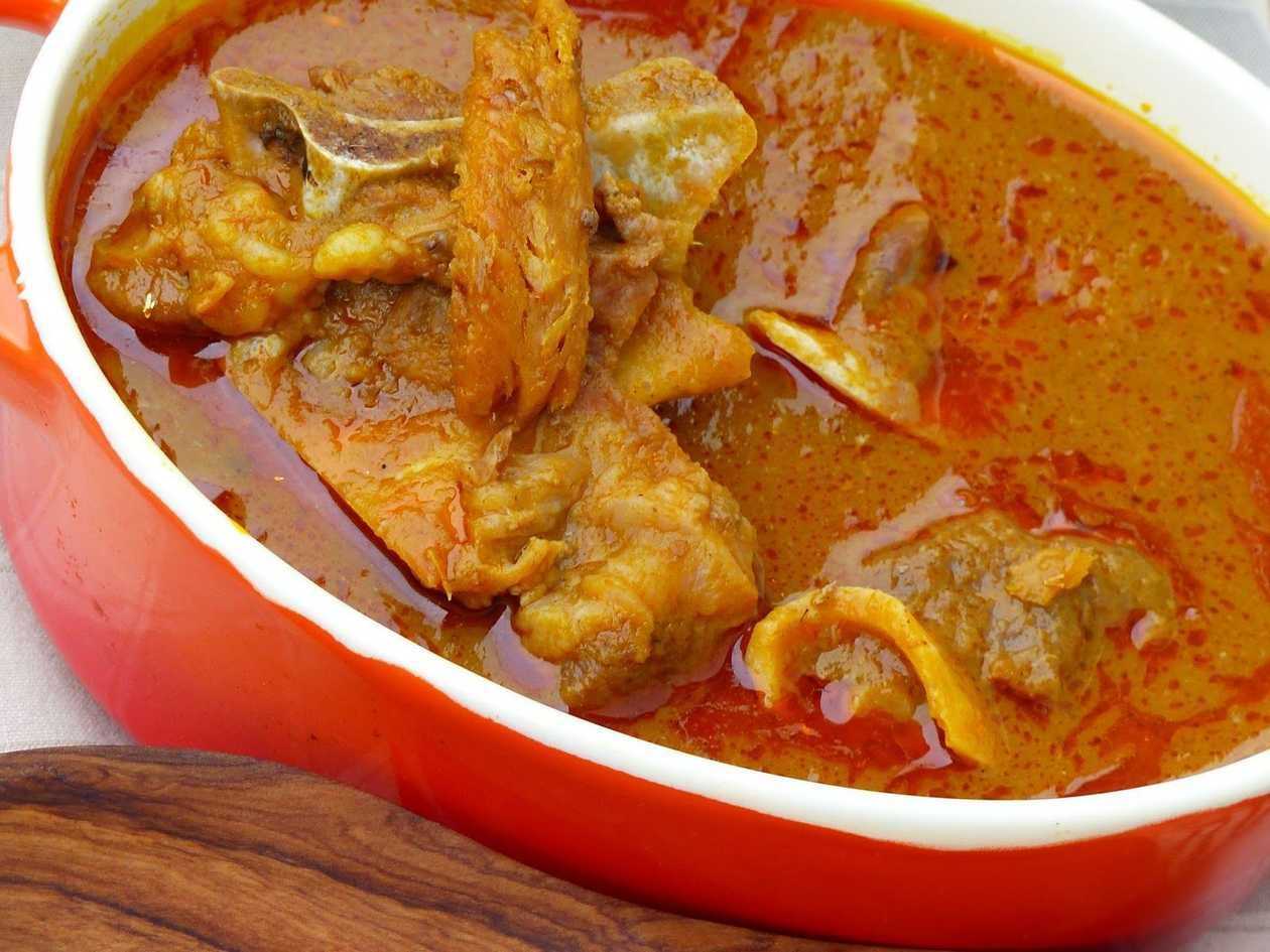 Fufu and palmnut soup with dry fish and chicken wings