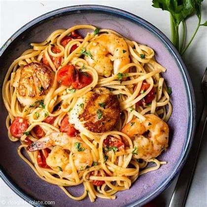 Seafood linguini with cherry tomatoes, garlic and chilly