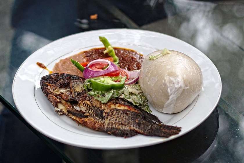 Banku with a Large Full Grilled Tilapia and Pepper Sauce