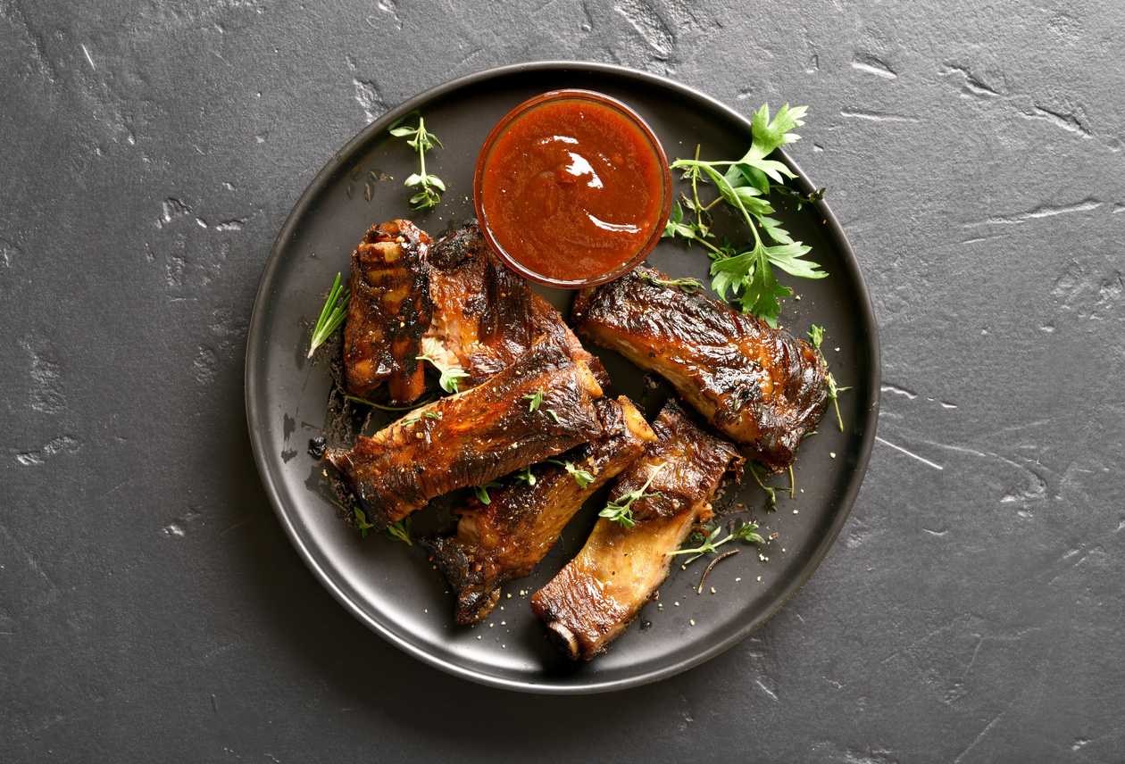 Smoked pork ribs BBQ, baked bread, mustard, horseradish