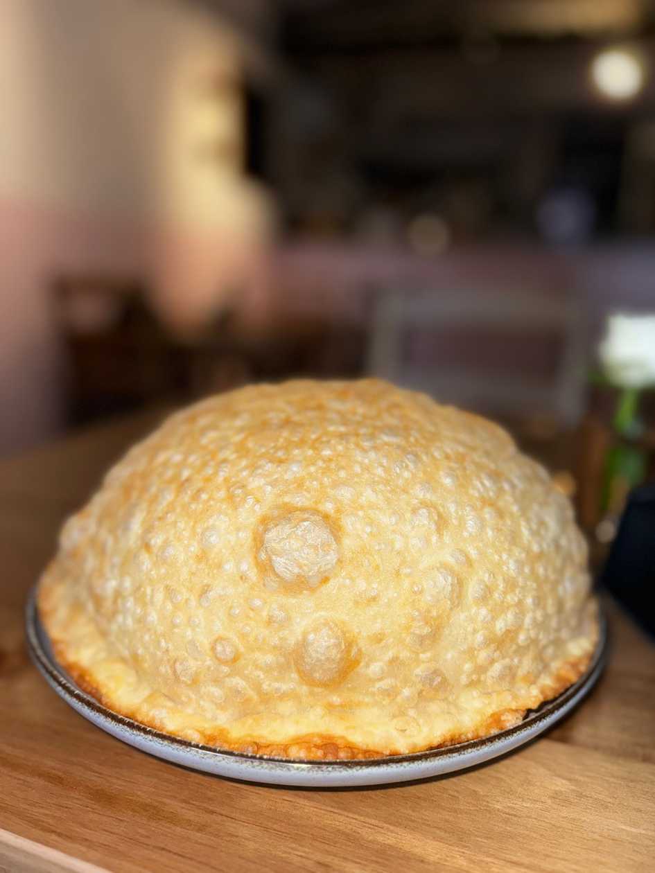 Cheburek with cottage cheese, spinach and tomatoes