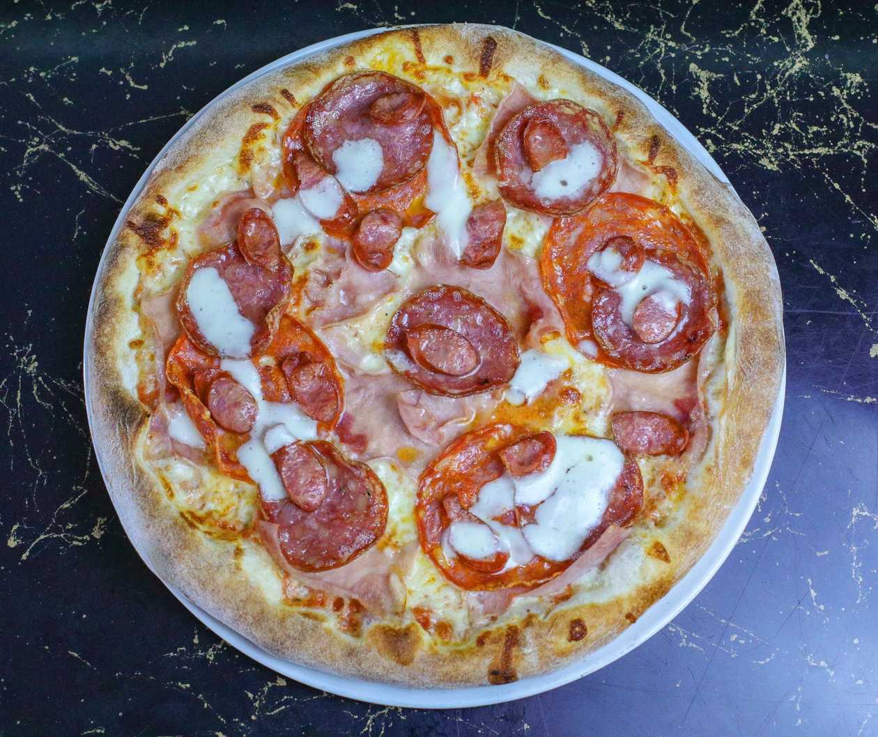 Pizza quattro carni