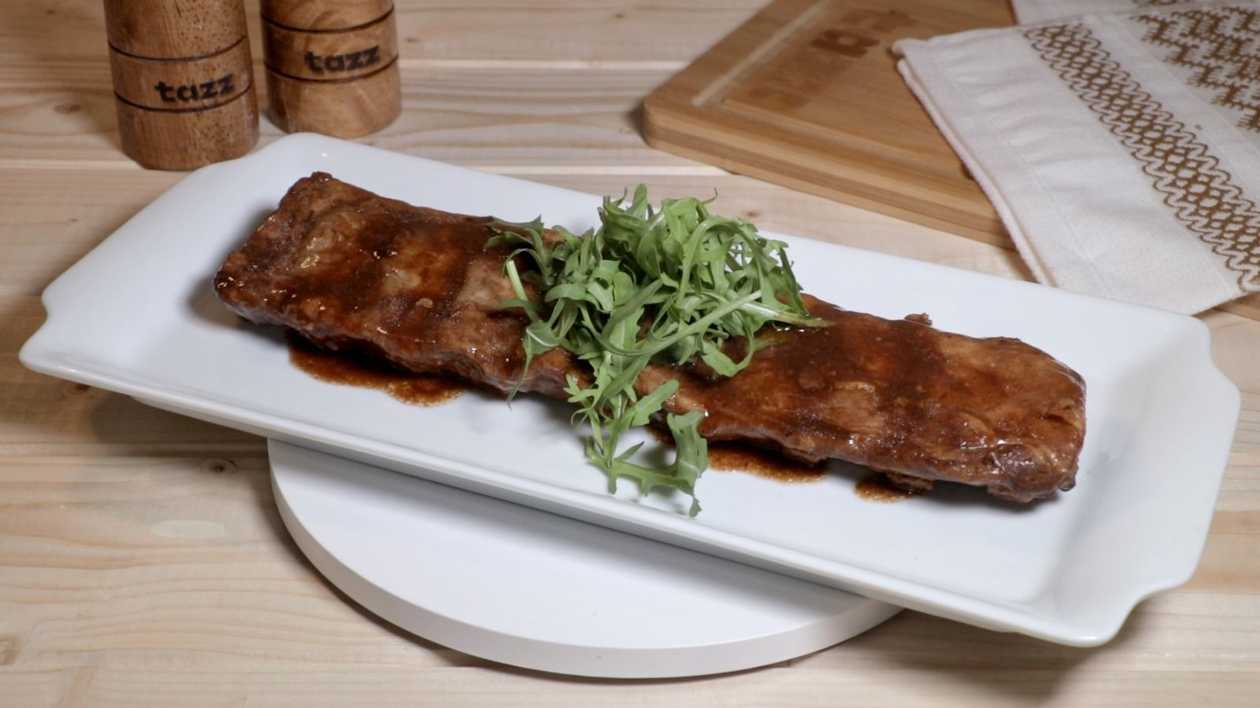Slow cooked pork ribs in the oven with BBQ sauce