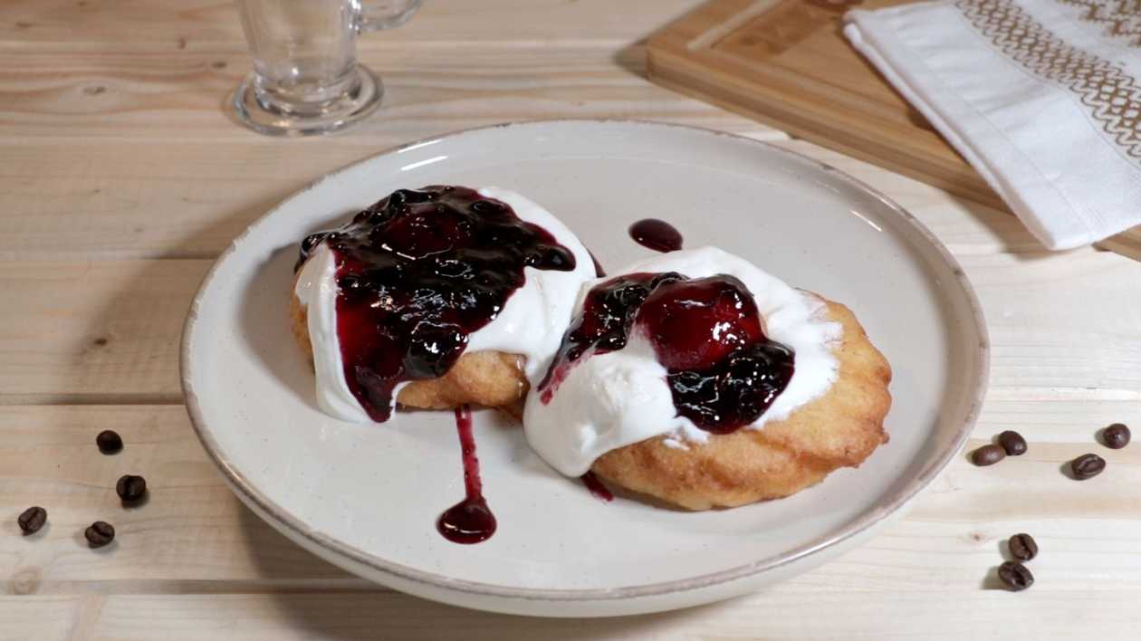 Romanian cheese doughnuts with blueberries