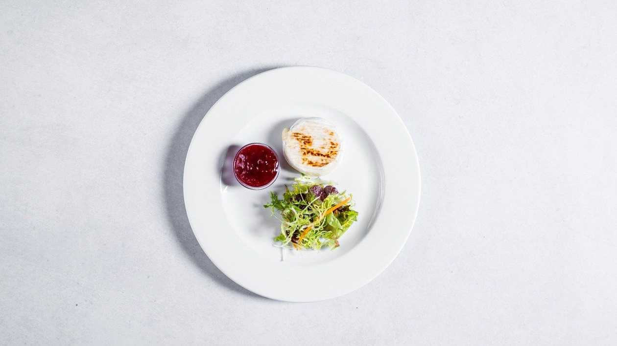 Grilled Camembert, plum chutney, salad, herb baguette