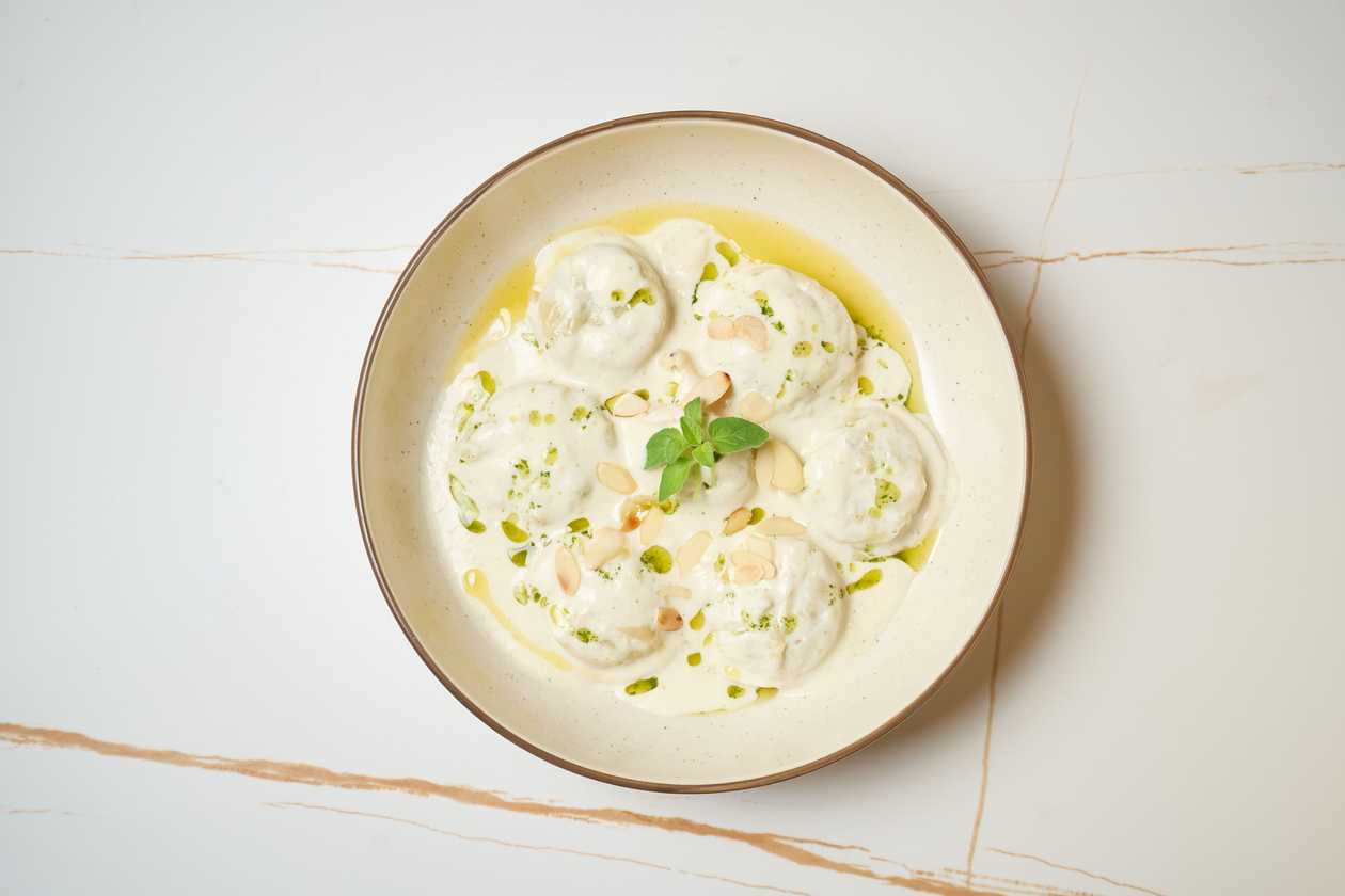 Broccoli Sorrentinos with Gorgonzola Cream and Toasted Almonds